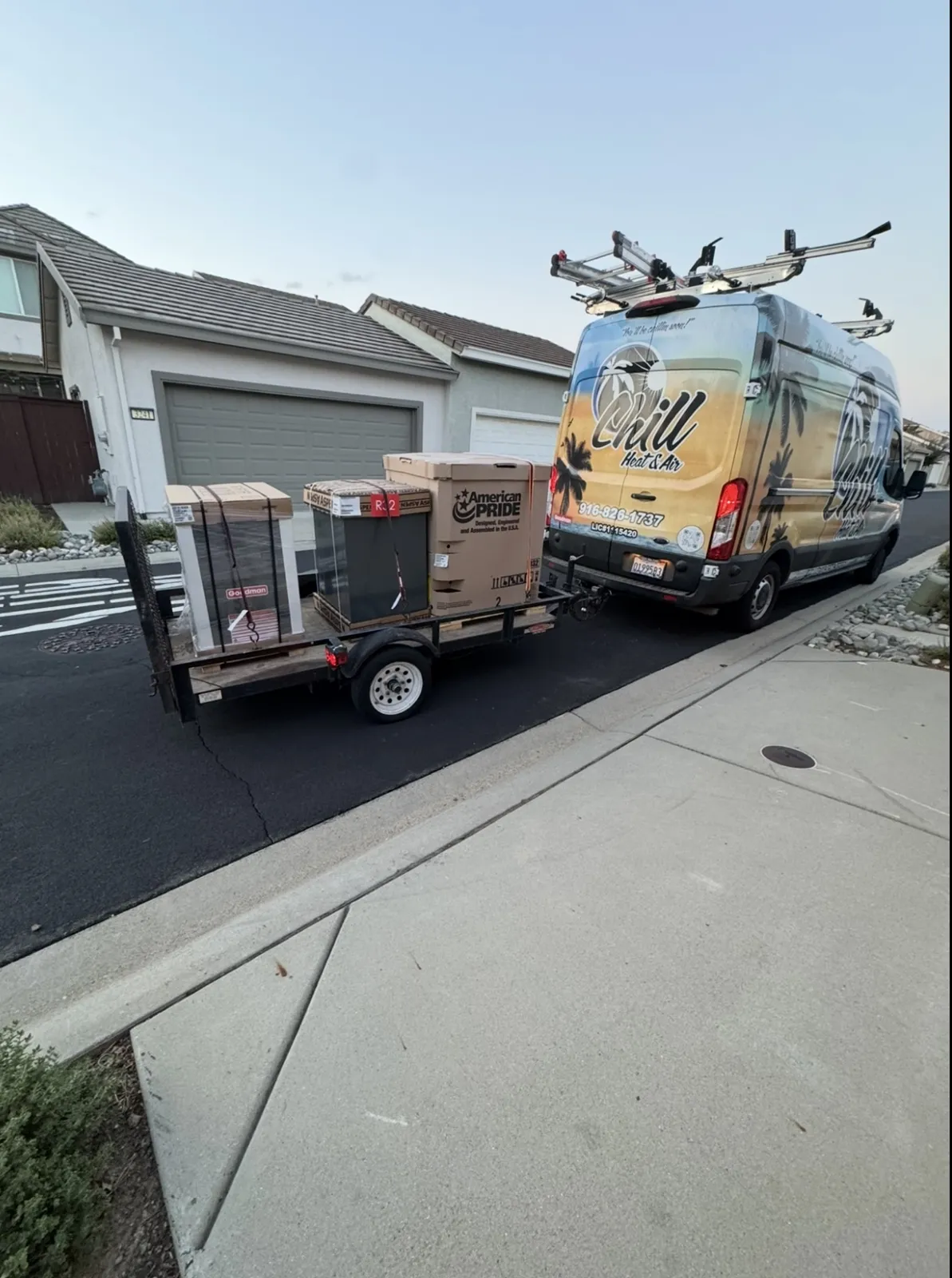 Chill van and trailer loaded with new boxed air conditioning equipment