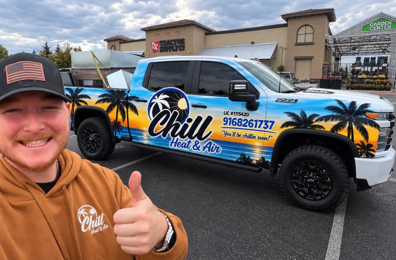 Cameron Hill, owner of Chill Heating & Air, beside the company service truck in Roseville, California
