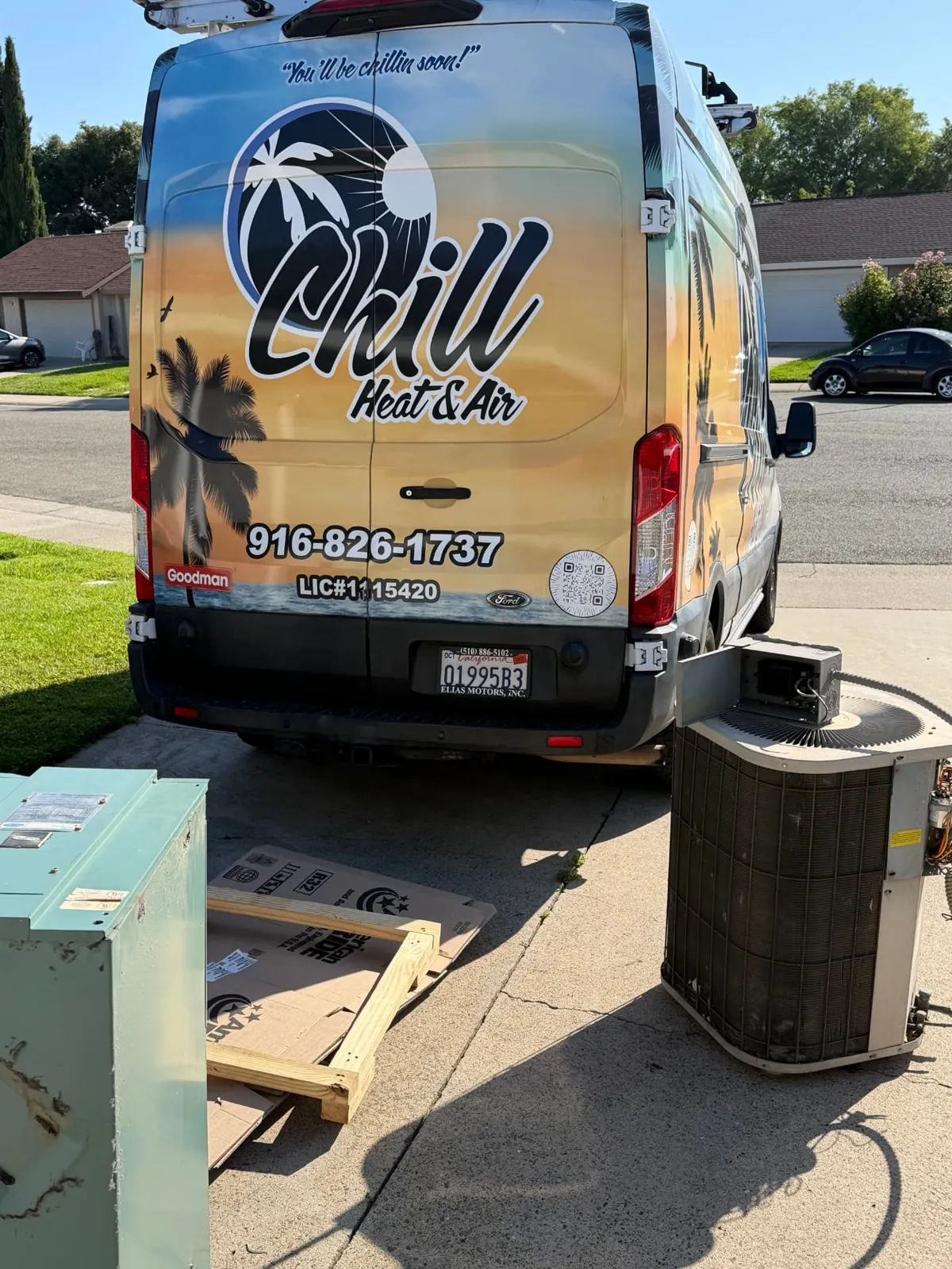 An old furnace cabinet removed and new equipment ready to install, with the Chill Heating & Air van behind